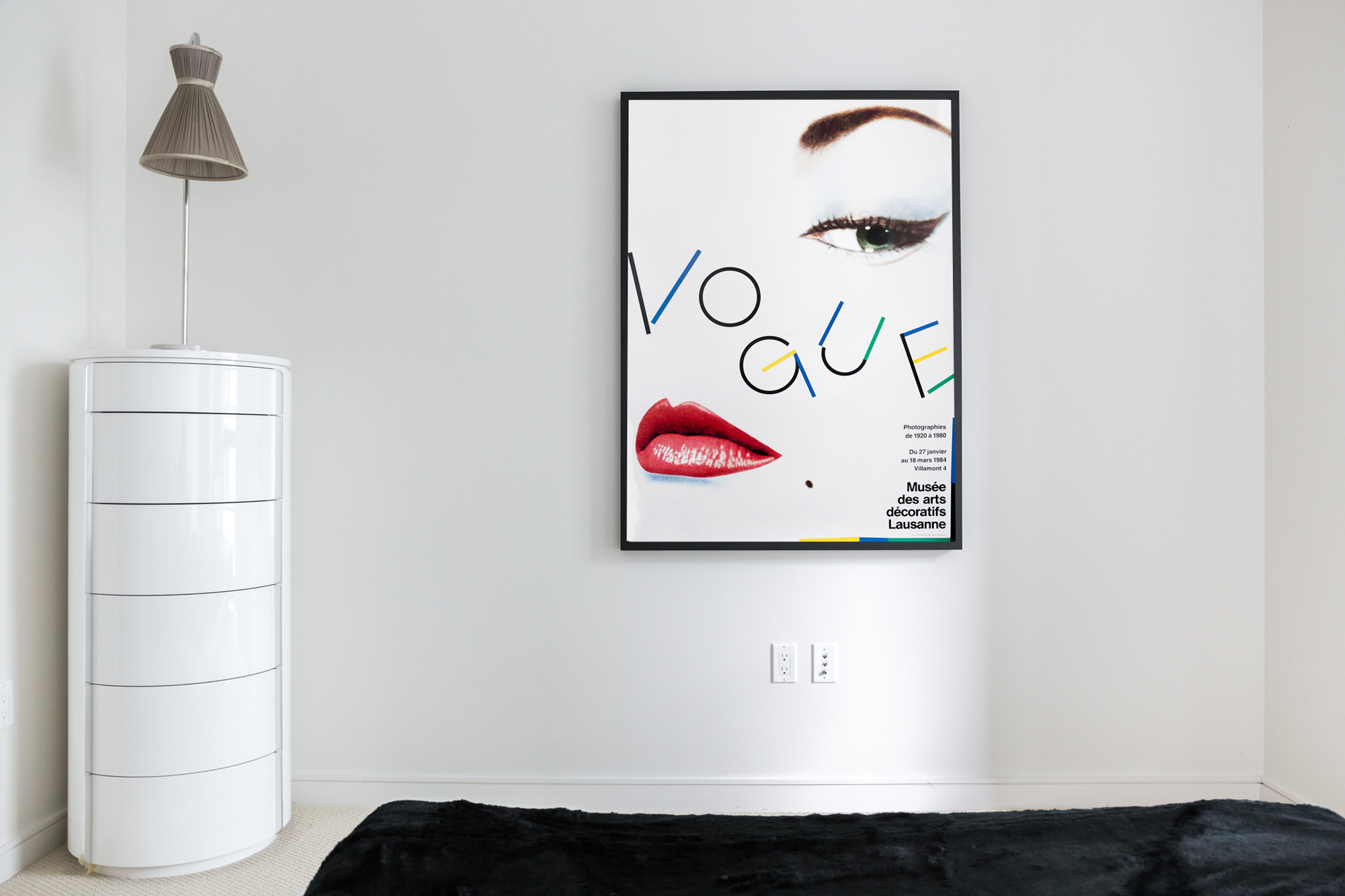Typographic Vogue poster in minimalist room; red, white, blue, black