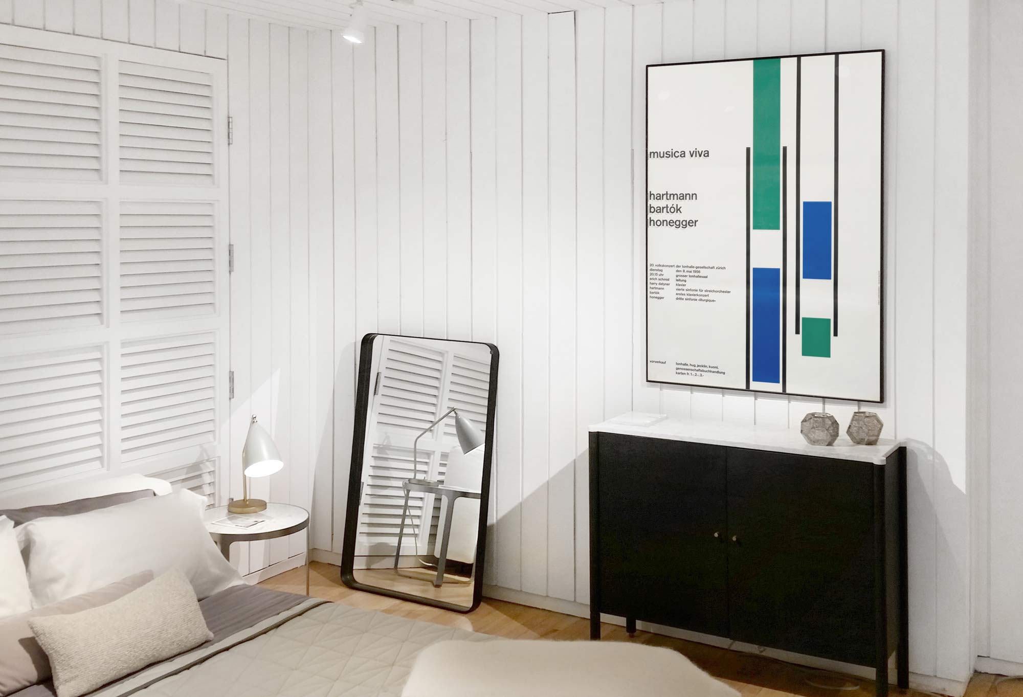 Typographic poster in Mid Century bedroom; white, green, blue, black